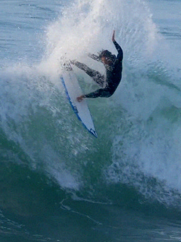 surfer slamming the lip of a wave on his CI 2.pro