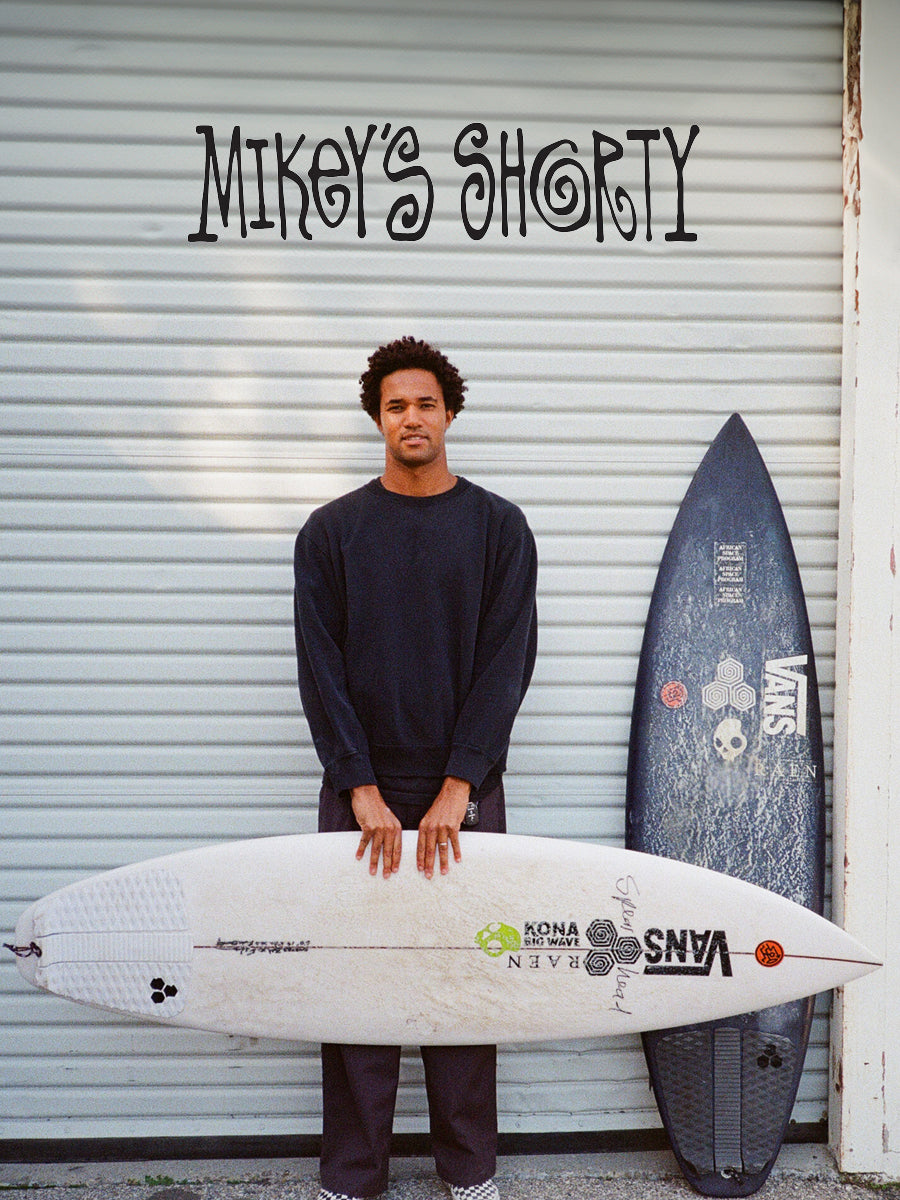 Surfer holding the Channel Islands Mikey's Shorty surfboard