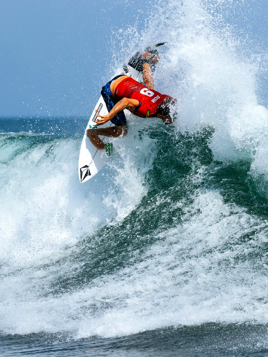 Pro surfer performing an aerial on the Lost Formula 1 Round Pin surfboard