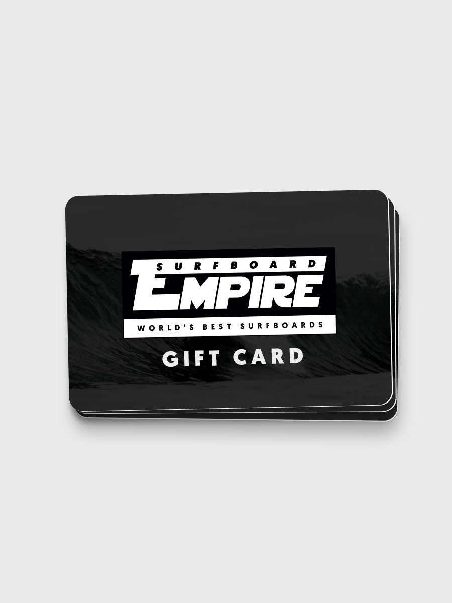 A stack of black Surfboard Empire gift cards with bold white text, shown on a light gray background.