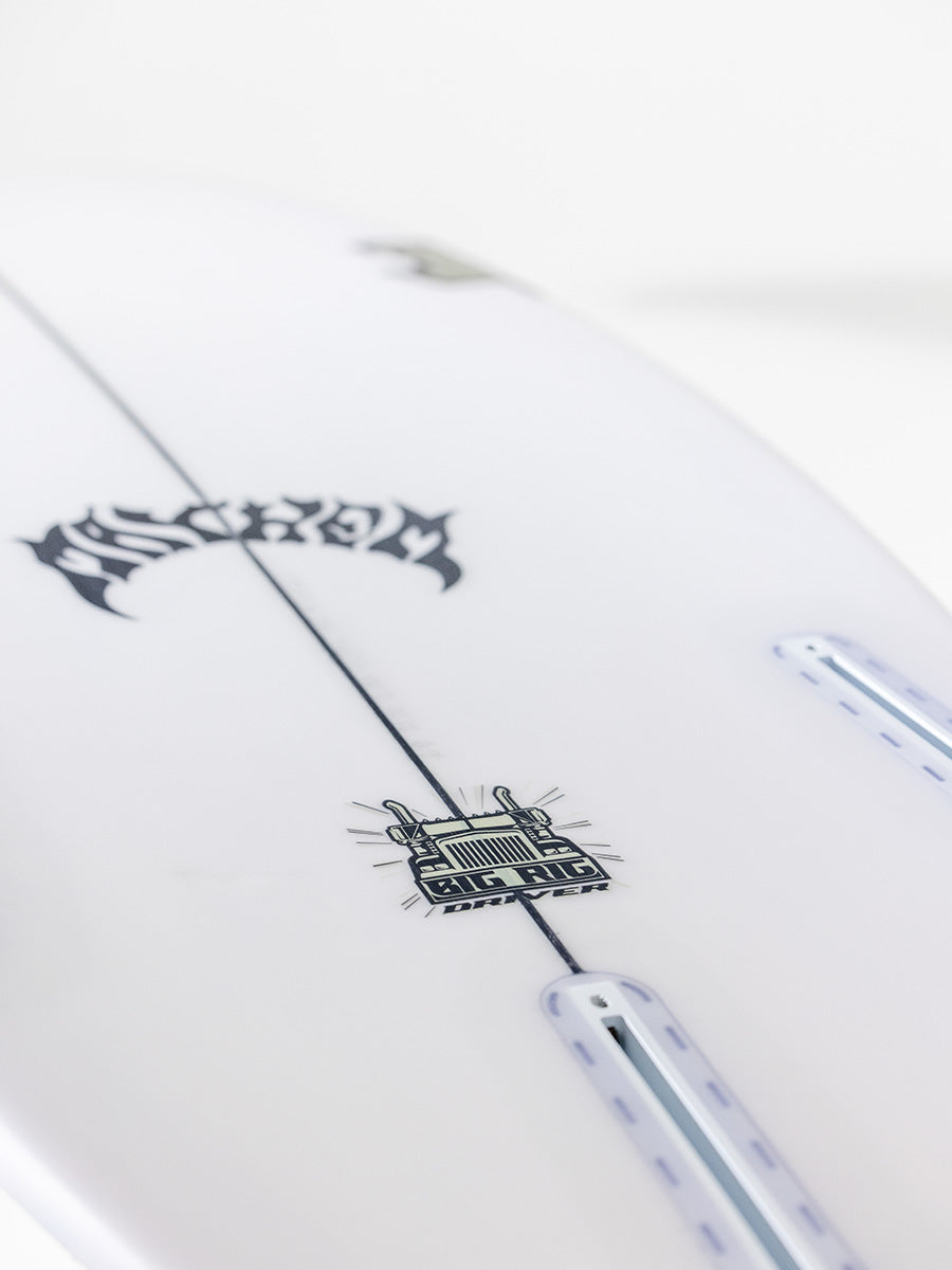Lost Big Rig Driver surfboard tail showing FCS II fin box setup