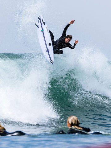 Athlete Surfing The Sub Scorcher STING by Lost Surfboards Front Air View