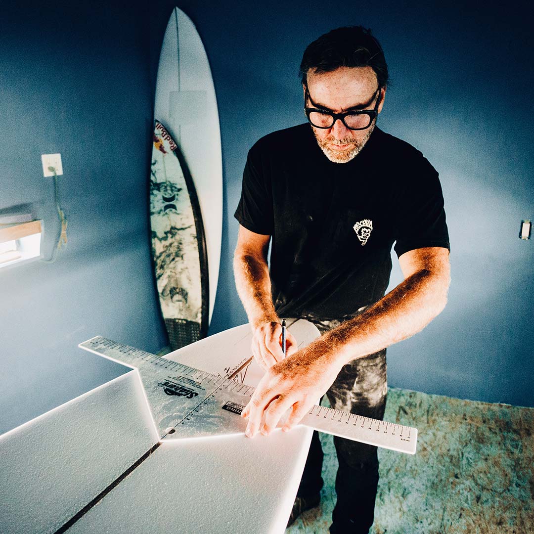 matt biolos shaping a high performance surfboard